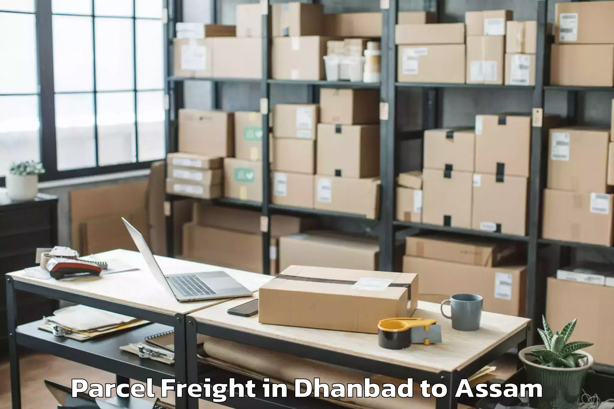 Book Your Dhanbad to Bodoland University Kokrajhar Parcel Freight Today